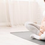 Workout, Fitness And Pregnancy Concept. Young Pregnant Woman Hol